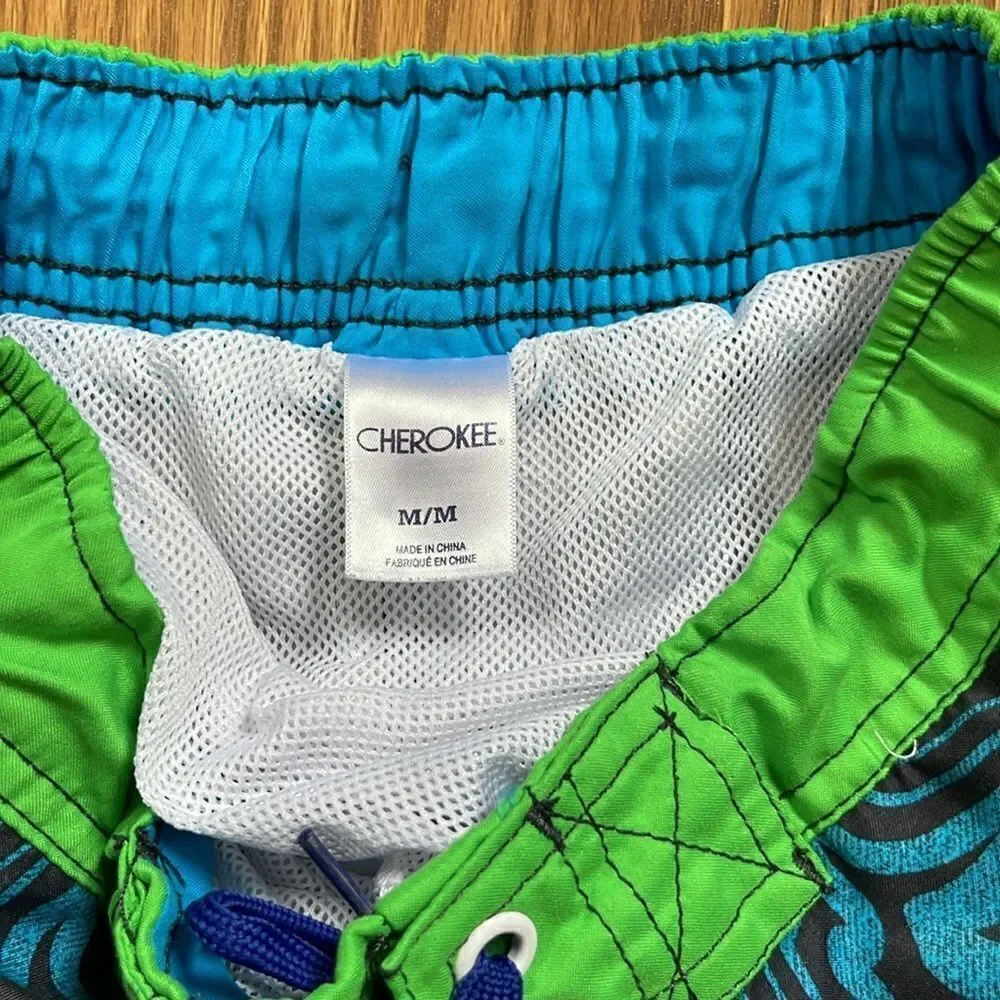 Cherokee swimming shorts. Drawstring waist. Size medium (10/12). Pockets.